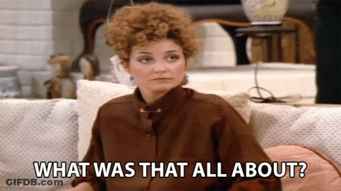 A Woman Sitting On A Couch With The Words What Was That All About GIF