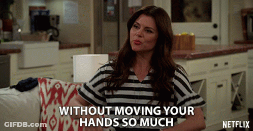 A Woman Sitting On A Couch With The Words Without Moving Your Hands So Much Written Below Her GIF