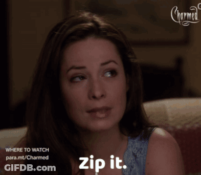 A Woman Sitting On A Couch With The Words Zip It On Her Chest GIF