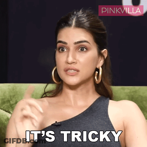 A Woman Sitting On A Green Couch With The Words It 'S Tricky On Her Face GIF