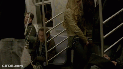 A Woman Sitting On A Train With A Bag That Says ' Subway ' On It GIF