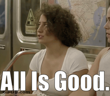 A Woman Sitting On A Train With The Words All Is Good Written On The Bottom GIF