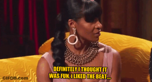 A Woman Sitting On A Yellow Couch Says " Definitely I Thought It Was Fun I Liked The Beat " GIF