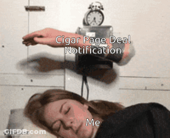 A Woman Sleeping Next To An Alarm Clock That Says Cigar Page Deal Notification On It GIF