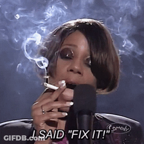 A Woman Smoking A Cigarette In Front Of A Microphone And Saying " I Said Fix It " GIF
