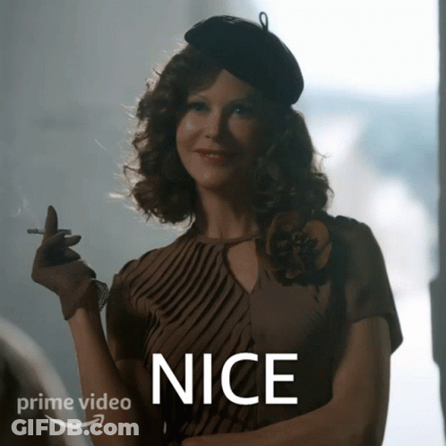 A Woman Smoking A Cigarette With The Word Nice On The Bottom Right GIF