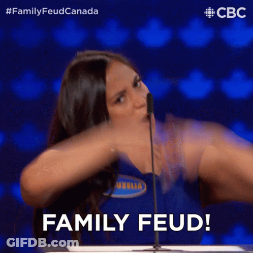 A Woman Speaking Into A Microphone With The Words Family Feud Behind Her GIF