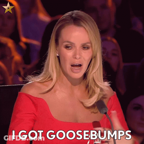 A Woman Speaking Into A Microphone With The Words " I Got Goosebumps " Below Her GIF