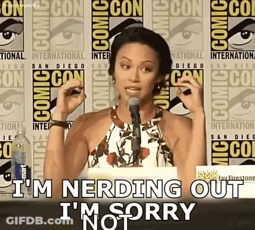 A Woman Speaking Into A Microphone With The Words I 'M Nerding Out I 'M Sorry Behind Her GIF