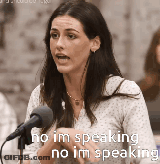 A Woman Speaking Into A Microphone With The Words " No Im Speaking No Im Speaking " Above Her GIF