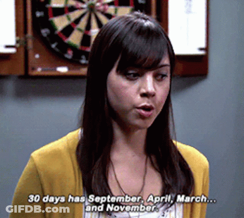 A Woman Standing In Front Of A Dart Board Says 30 Days Has September April March And November GIF