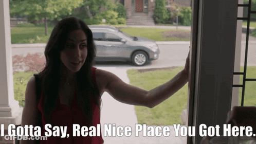 A Woman Standing In Front Of A Door That Says " I Gotta Say " GIF