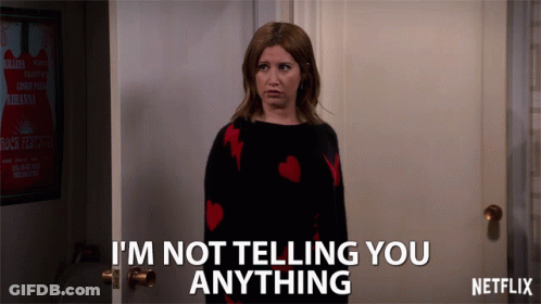 A Woman Standing In Front Of A Door That Says I 'M Not Telling You Anything By Netflix GIF