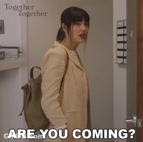 A Woman Standing In Front Of A Door With The Words " Are You Coming " On The Bottom GIF