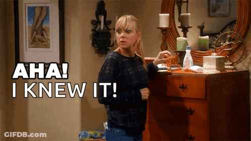 A Woman Standing In Front Of A Dresser With Aha I Knew It Written Above Her GIF