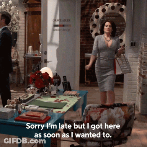 Woman Standing In Front Of Grace Adler Interior Design GIF