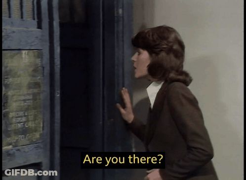 A Woman Standing In Front Of A Locker With The Words Are You There On The Screen GIF