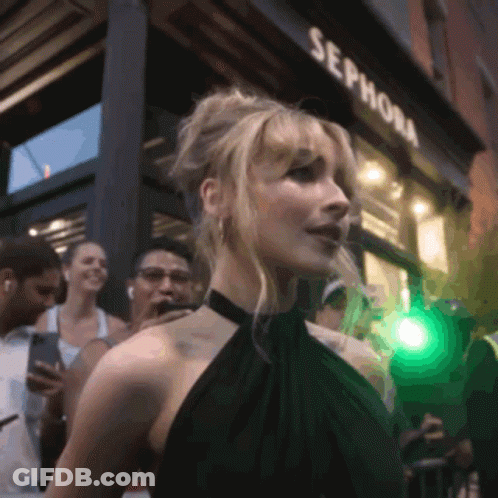 A Woman Standing In Front Of A Sephora Store GIF