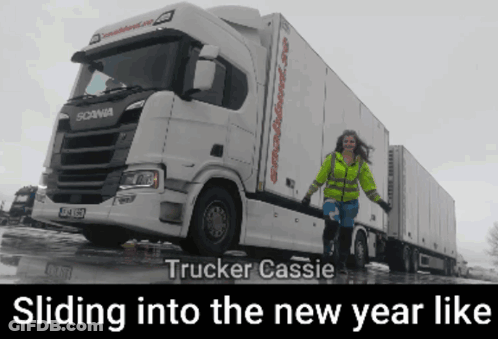 A Woman Standing In Front Of A White Scania Truck With The Caption Trucker Cassie Sliding Into The New Year Like GIF
