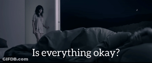 A Woman Standing Next To A Bed With The Words " Is Everything Okay " On The Bottom GIF