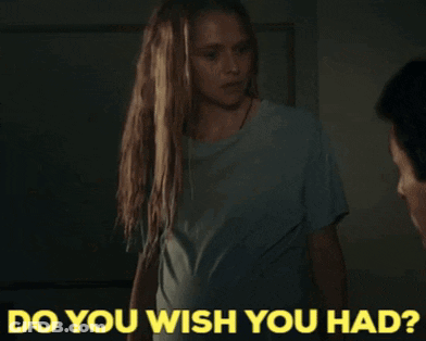 A Woman Standing Next To A Man With The Words " Do You Wish You Had " Written Below Her GIF