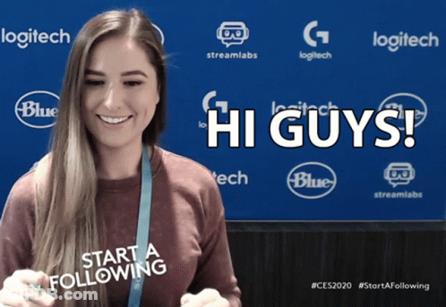 A Woman Stands In Front Of A Blue Background That Says Logitech And Blue GIF