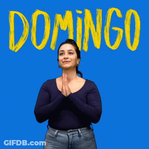 A Woman Stands In Front Of A Blue Background With The Word Domingo Written In Yellow GIF