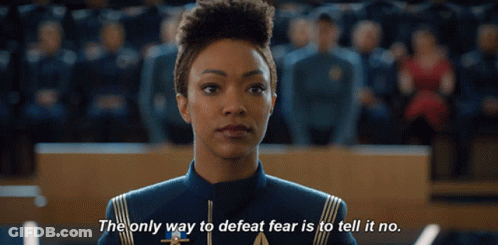 A Woman Stands In Front Of A Crowd And Says The Only Way To Defeat Fear Is To Tell It No GIF