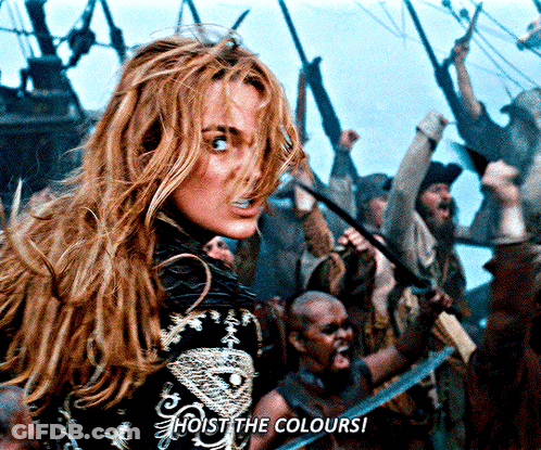 A Woman Stands In Front Of A Crowd With The Words Hoist The Colours GIF