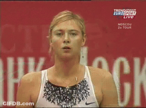 A Woman Stands In Front Of A Eurosport Live Sign GIF