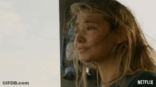 A Woman Stands In Front Of A Lantern With The Word Netflix On The Bottom Right GIF