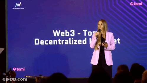 A Woman Stands In Front Of A Large Screen That Says Web3 Tor Decentralized GIF