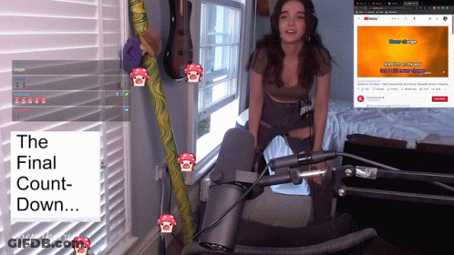 A Woman Stands In Front Of A Microphone With The Words " The Final Count-Down " On The Bottom Right GIF
