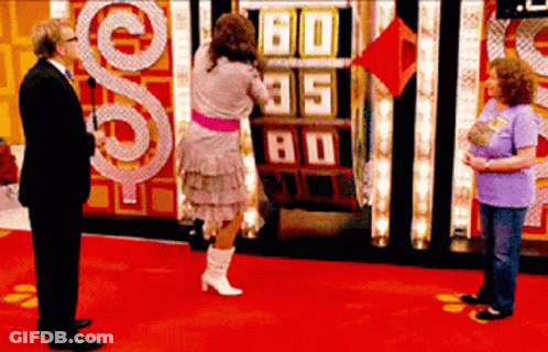 A Woman Stands In Front Of A Scoreboard That Says 60 85 80 GIF