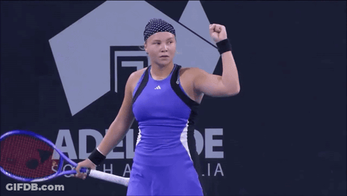 A Woman Stands In Front Of A Sign That Says Adelaide On It GIF