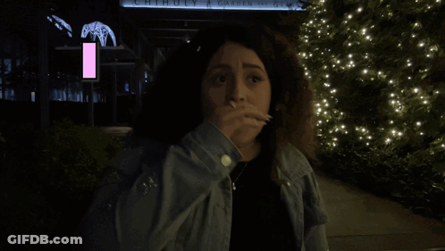 Woman Standing In Front Of Chihuly Garden Of Glass GIF