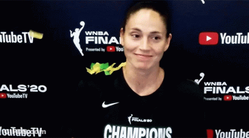 Woman Standing In Front Of YouTube TV Sign GIF