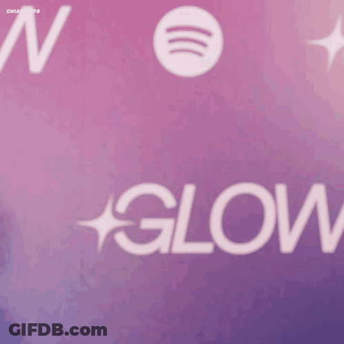 A Woman Stands In Front Of A Spotify Logo GIF