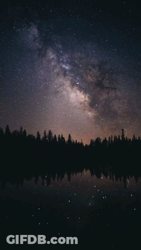 A Woman Stands In Front Of A Starry Night Sky With The Name Oea Written On The Bottom GIF
