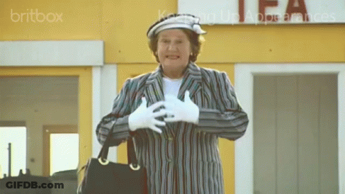 A Woman Stands In Front Of A Tea Store GIF