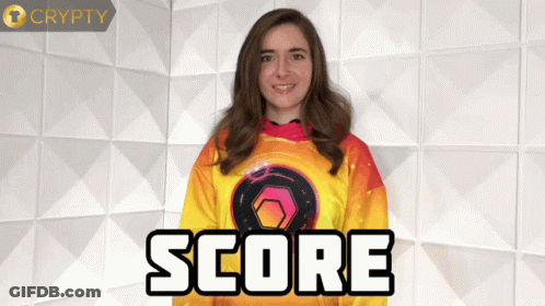 A Woman Stands In Front Of A Wall With The Word Score Written On It GIF