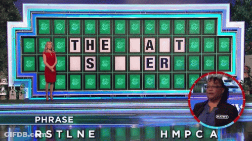 A Woman Stands In Front Of A Wheel Of Fortune Board That Says " The At " On It GIF