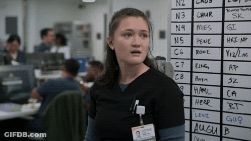 A Woman Stands In Front Of A White Board With The Letters N3 And Chur Written On It GIF