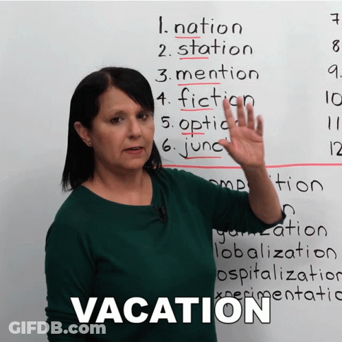 A Woman Stands In Front Of A White Board With The Word Vacation On It GIF