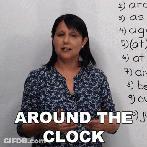 Woman Standing In Front Of Whiteboard With Around The Clock GIF