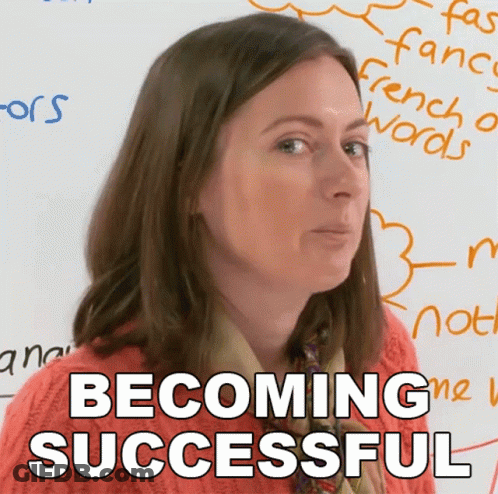 A Woman Stands In Front Of A White Board With The Words Becoming Successful On It GIF