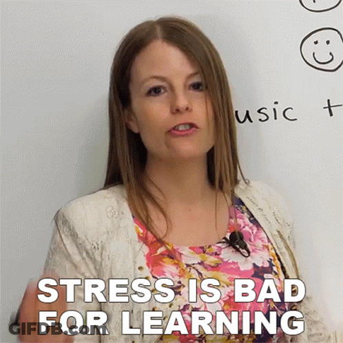 A Woman Stands In Front Of A White Board With The Words " Stress Is Bad For Learning " GIF