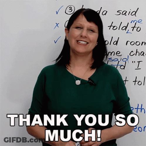 A Woman Stands In Front Of A White Board With The Words Thank You So Much GIF