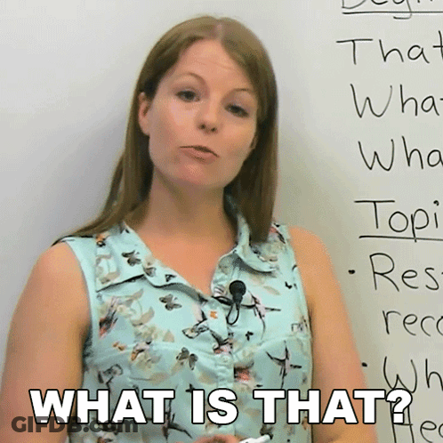 A Woman Stands In Front Of A White Board With The Words What Is That On It GIF