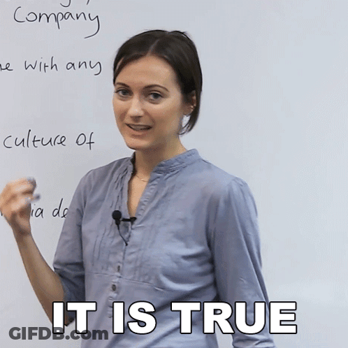 A Woman Stands In Front Of A Whiteboard With The Words " Company " Written In Cursive GIF